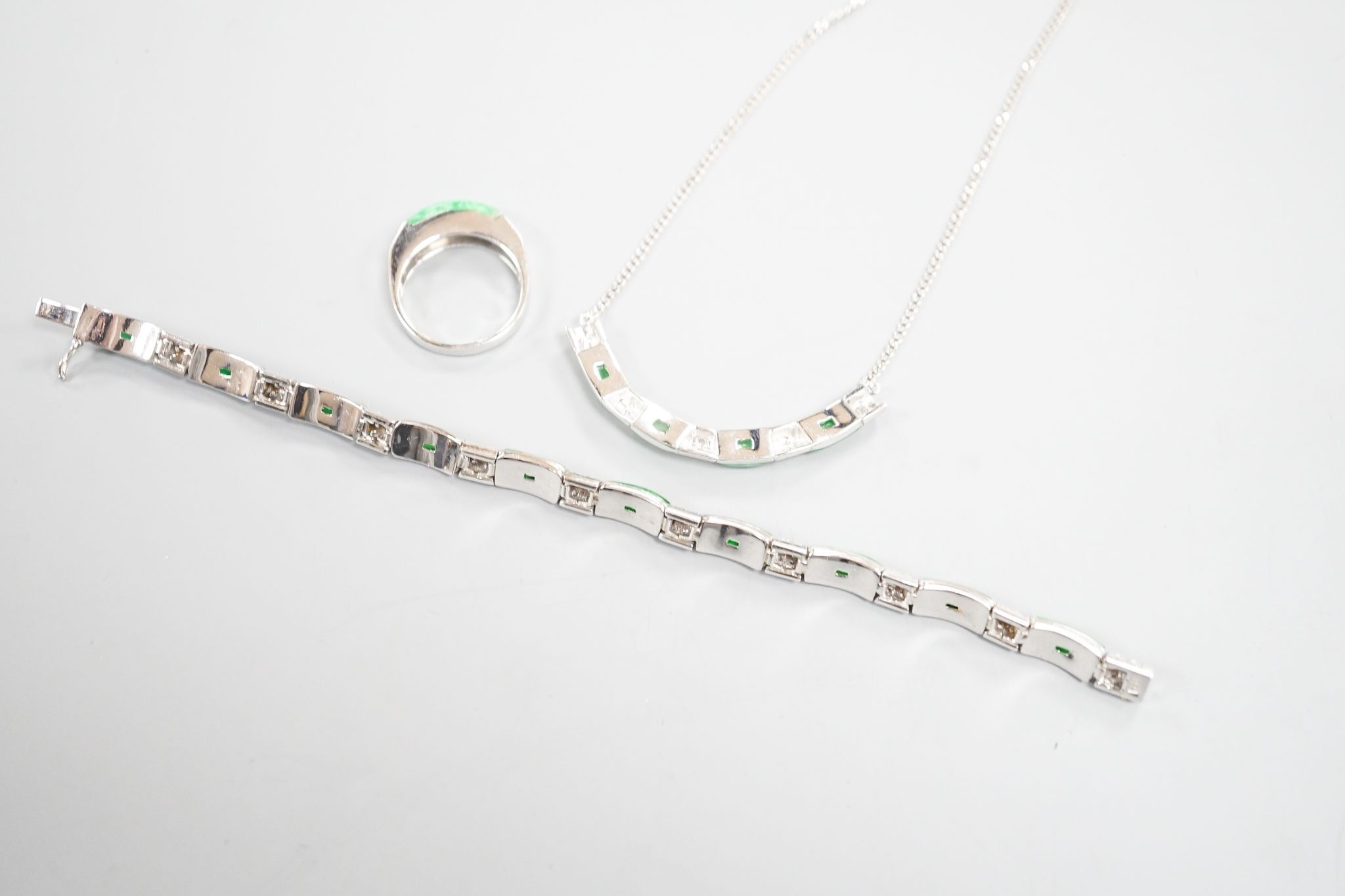 A modern white metal (stamped 850), jade and diamond cluster set bracelet, approx. 15.5cm, with a matching ring, size O and necklace, 38cm